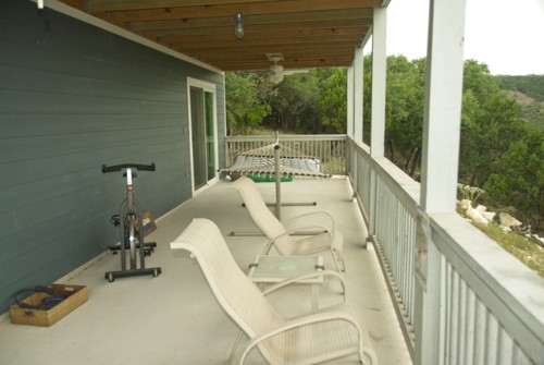 Downstairs porch. The exercise equipment is in the garage now.